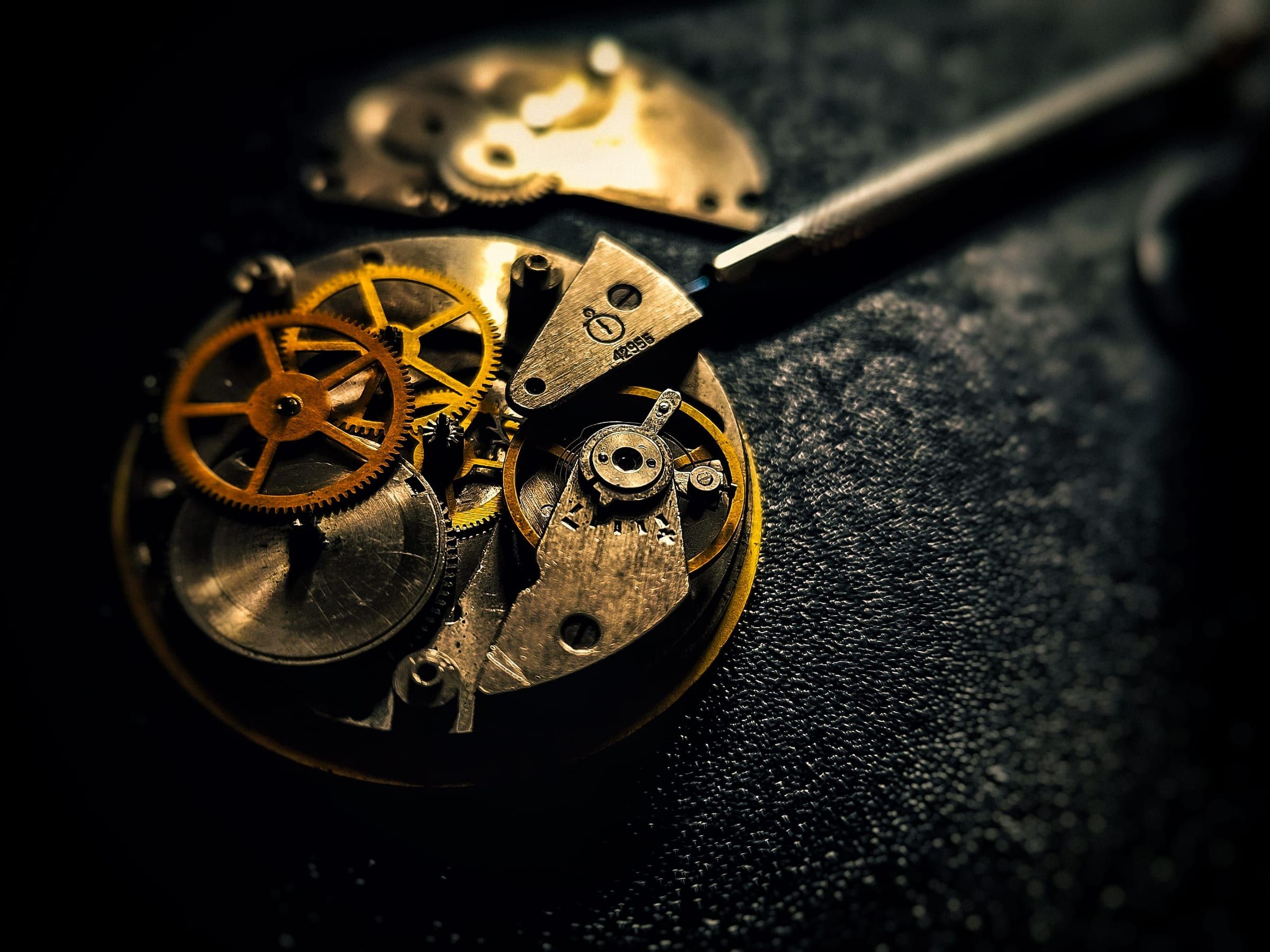 Editorial photograph — the intricate movement of a mechanical watch in close detail
